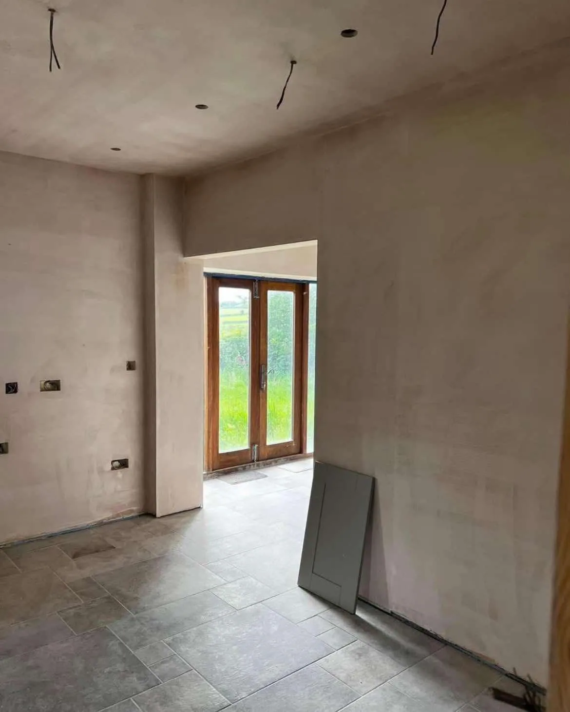 Completed wall and ceiling plastering with doorway returns in a Roundhay, Leeds extension
