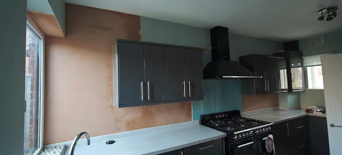 Freshly plastered kitchen wall sections around fitted cupboards and above worktops in Roundhay, Leeds